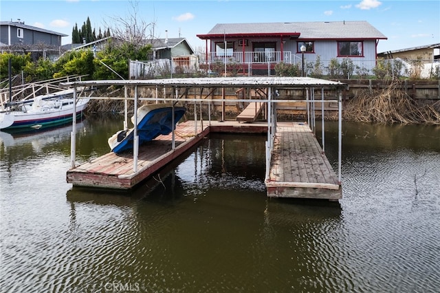 dock area with a water view