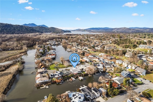 drone / aerial view featuring a water and mountain view