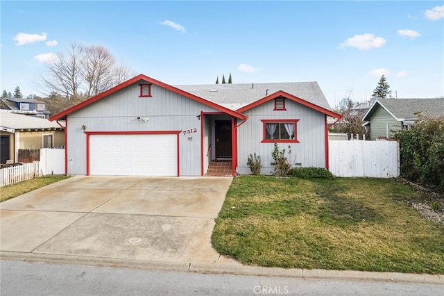 view of front facade with a front yard and a garage