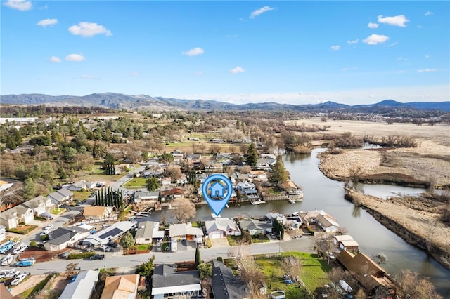 bird's eye view with a water and mountain view