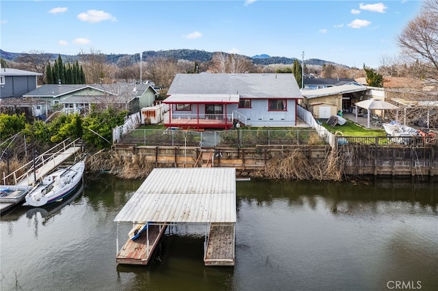 dock area featuring a water and mountain view