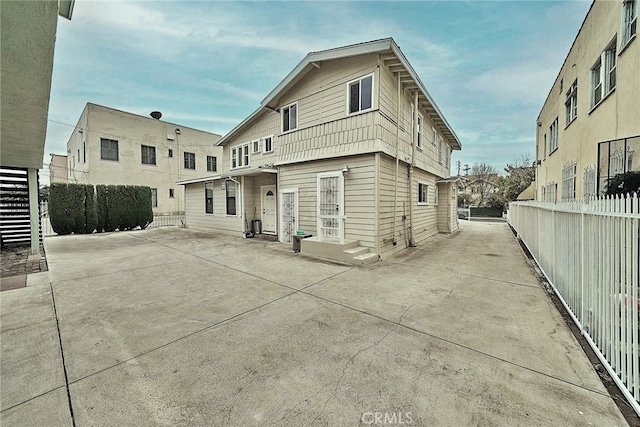 rear view of property featuring a patio