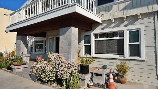 doorway to property featuring a balcony