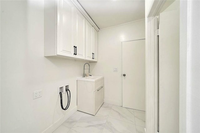 laundry room featuring marble finish floor, hookup for a washing machine, cabinet space, a sink, and baseboards