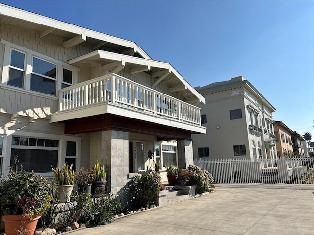 view of building exterior featuring fence