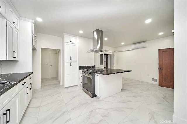 kitchen with stainless steel range with gas cooktop, marble finish floor, recessed lighting, visible vents, and island range hood