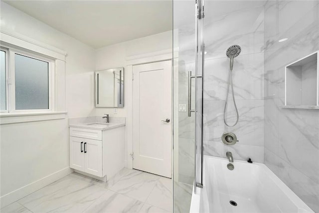 full bath featuring marble finish floor, vanity, baseboards, and shower / bathing tub combination