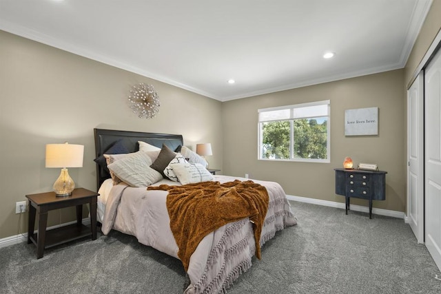 carpeted bedroom with a closet and crown molding