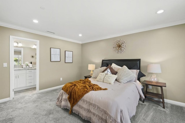 bedroom featuring light carpet, crown molding, and connected bathroom