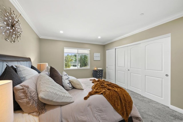 bedroom featuring carpet floors, a closet, and ornamental molding