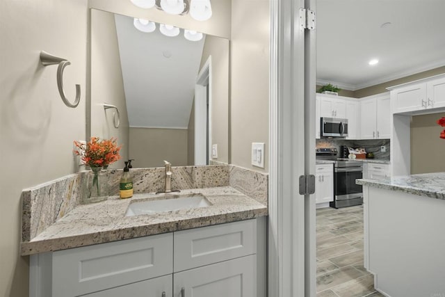 bathroom featuring backsplash, vanity, and ornamental molding