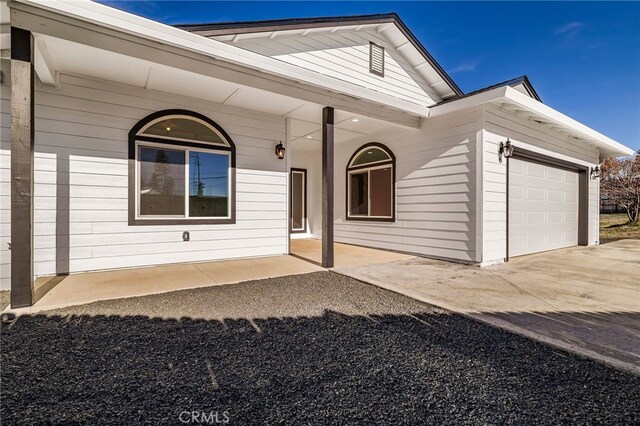 doorway to property featuring a garage