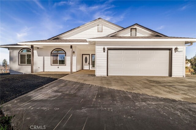 ranch-style home featuring a garage