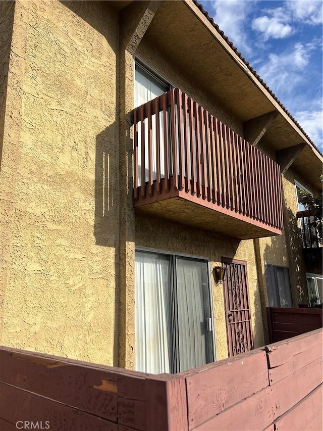 view of property exterior featuring a balcony