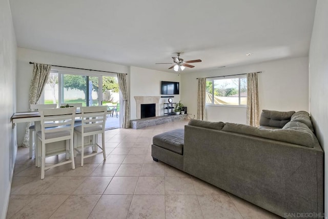 tiled living room featuring ceiling fan