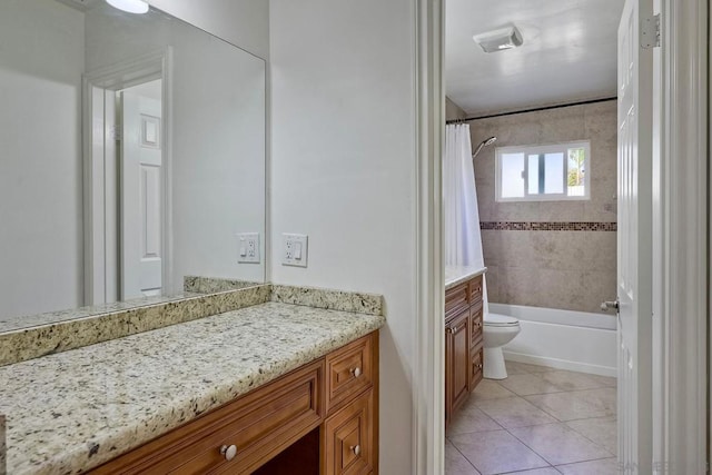 full bathroom with toilet, vanity, tile patterned flooring, and shower / bath combo