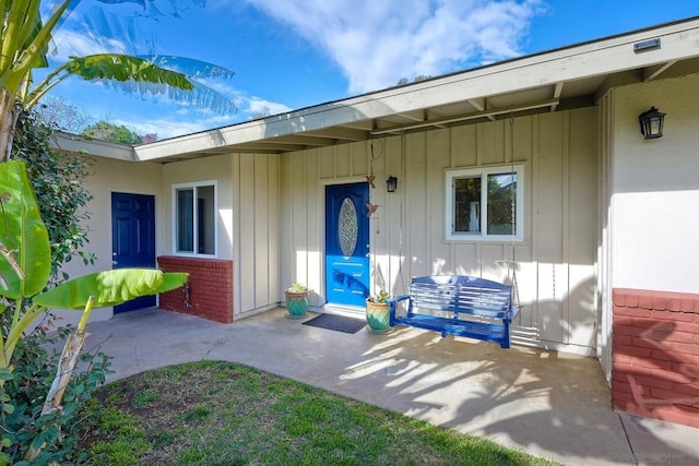 doorway to property with a patio