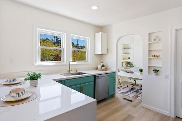 kitchen featuring dishwasher, sink, white cabinets, light hardwood / wood-style floors, and green cabinetry