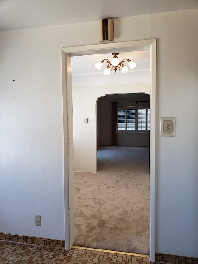 hallway featuring carpet floors