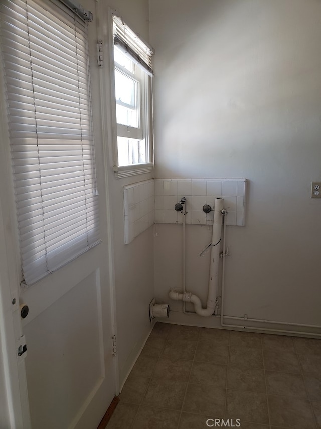 laundry area featuring tile patterned floors