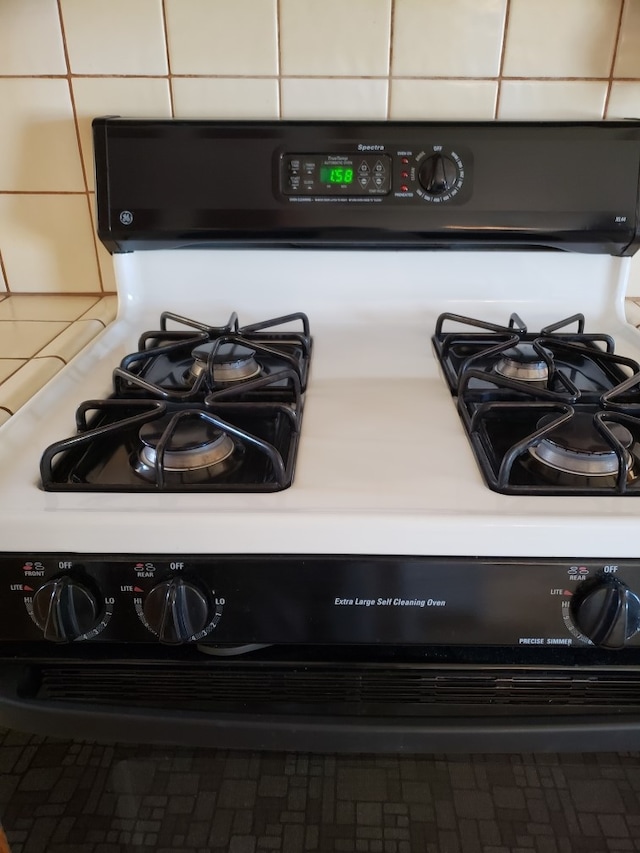 interior details featuring white gas stove