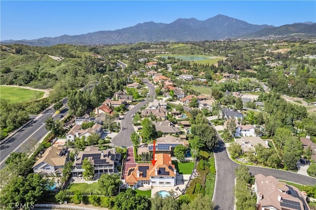 drone / aerial view featuring a mountain view