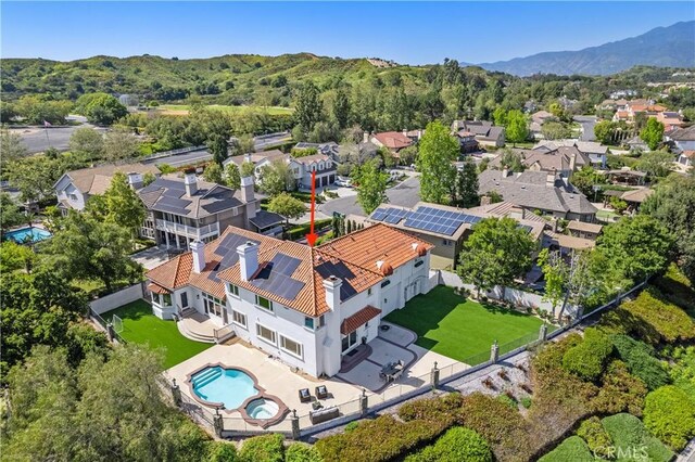 drone / aerial view featuring a mountain view