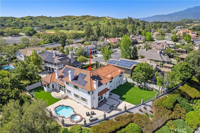 birds eye view of property with a mountain view