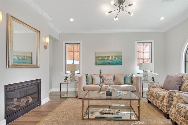 living room with a chandelier, crown molding, and wood-type flooring