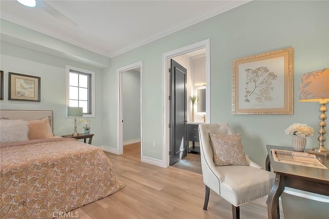 bedroom featuring ceiling fan, light hardwood / wood-style flooring, and crown molding