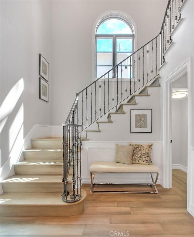 staircase with wood-type flooring