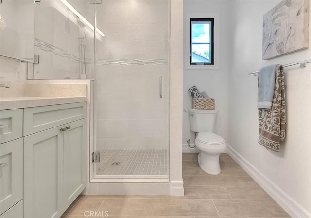 bathroom with toilet, tile patterned flooring, an enclosed shower, and vanity