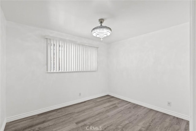 unfurnished room featuring hardwood / wood-style floors