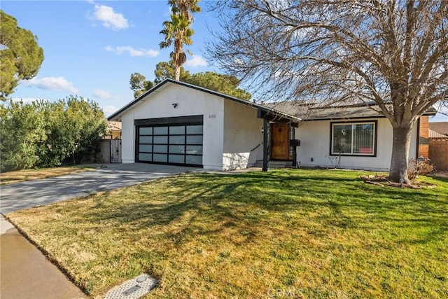 view of front of property featuring a front yard and a garage