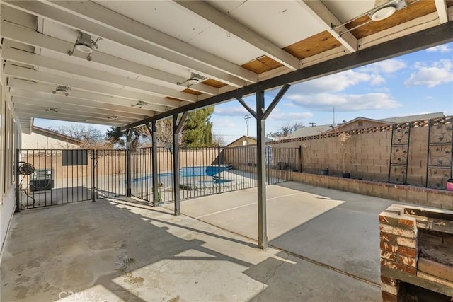 view of patio / terrace with a fenced in pool