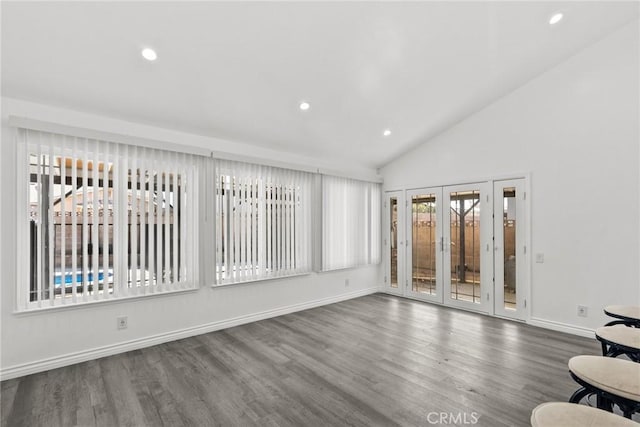 interior space featuring french doors and vaulted ceiling