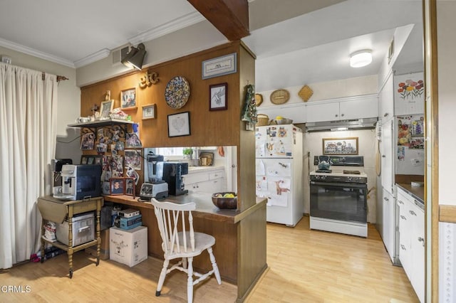 kitchen with ornamental molding, white cabinets, a breakfast bar, and white appliances