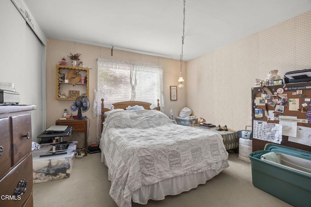 carpeted bedroom with a closet