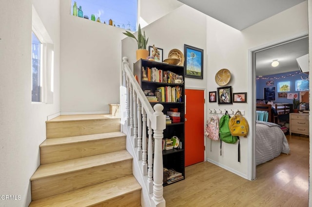 stairway featuring hardwood / wood-style floors