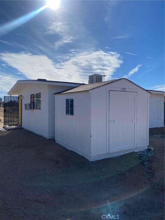 exterior space with cooling unit and central AC unit