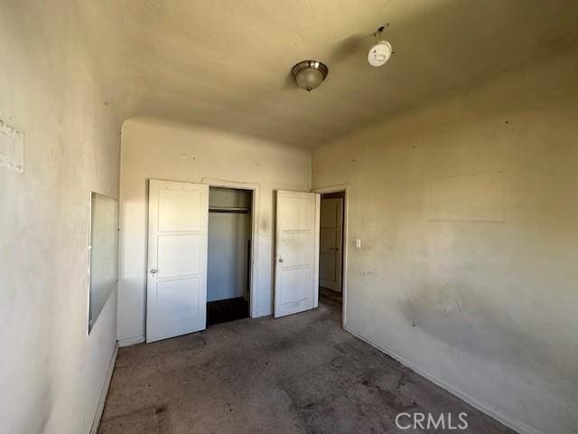 unfurnished bedroom with a closet