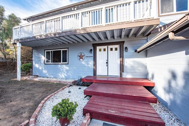 doorway to property with a balcony