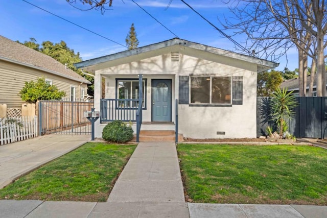 bungalow-style house with covered porch and a front yard