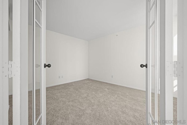 empty room featuring carpet floors