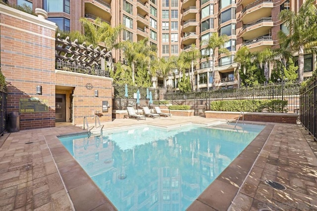 view of swimming pool featuring a patio