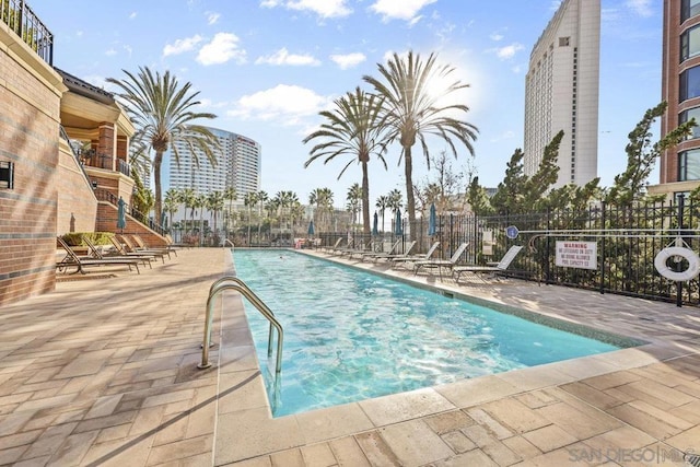 view of swimming pool featuring a patio area