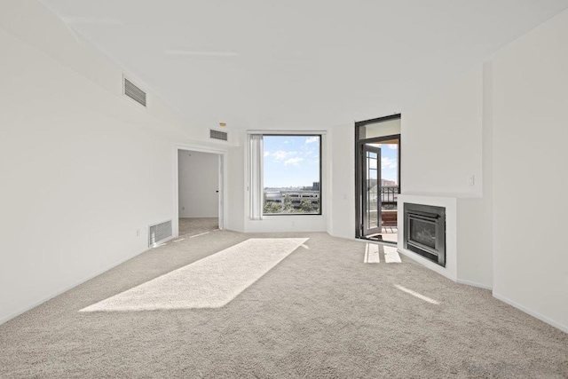 unfurnished living room featuring carpet