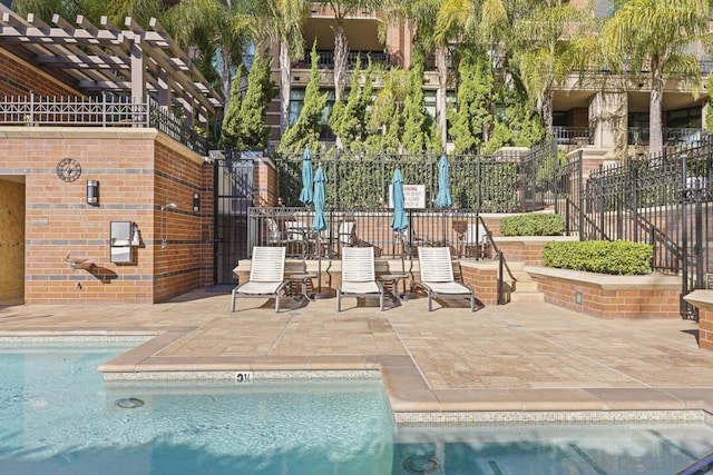 view of pool featuring a pergola and a patio