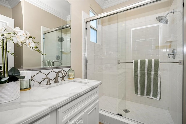 bathroom featuring crown molding and a shower with door