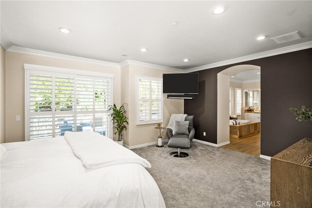 bedroom featuring ensuite bath, access to exterior, carpet floors, and ornamental molding